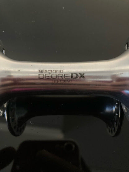 Mozzi Shimano Deore DX, M-650. 7v UG-HG. Posteriore 135mm.